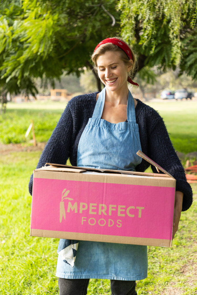 Chef Analise Roland holding an Imperfect Foods box